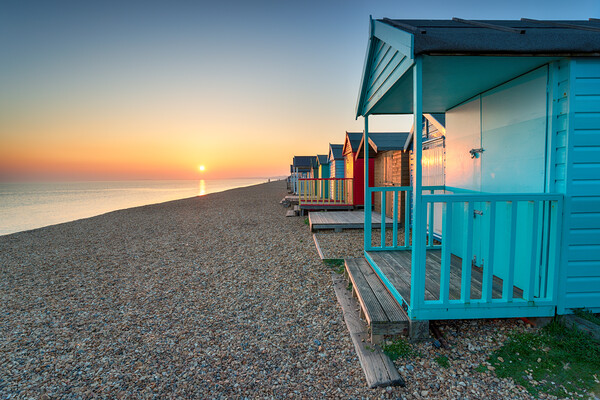 Stunning sunset over seaside beach huts  Picture Board by Helen Hotson