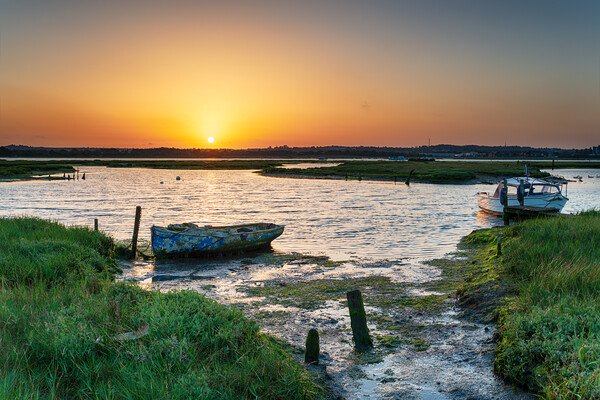 Summer sunrise over old boats on the shores of Holes Bay Picture Board by Helen Hotson