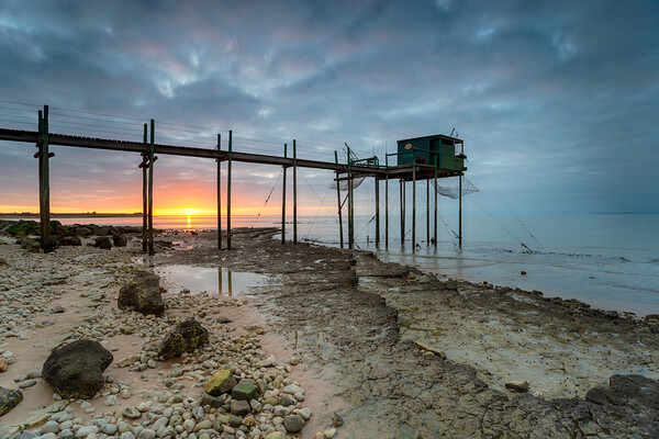 Sunset over fishing carrelets at Marsilly  Picture Board by Helen Hotson