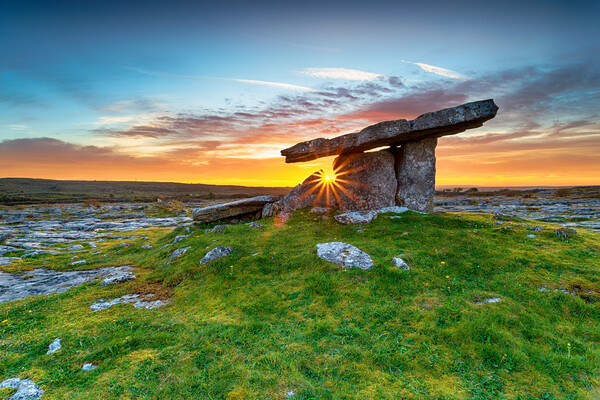 Sunset over Poulnabrone dolmen an ancient portal tomb in the Bur Picture Board by Helen Hotson