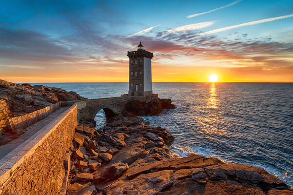 Sunset over the Lighthouse at Kermorvan Picture Board by Helen Hotson