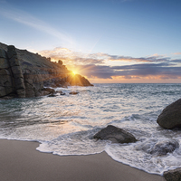 Buy canvas prints of Beautiful Sunrise over a sandy cove by Helen Hotson