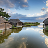 Buy canvas prints of Thatched Boat Houses by Helen Hotson