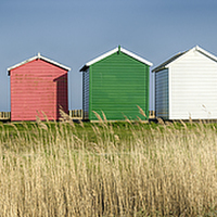 Buy canvas prints of Colourful Beach Huts by Helen Hotson