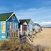 Buy canvas prints of Vibrant Luxury Beach Huts at Mudeford Spit by Helen Hotson