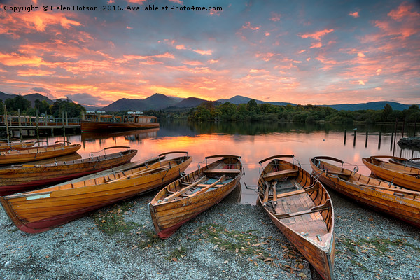 Stunning sunset over wooden rowing boats on Derwen Picture Board by Helen Hotson