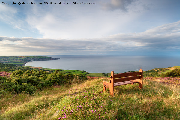 A wooden bench facing out to sea above Ravenscar o Picture Board by Helen Hotson