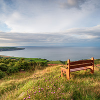 Buy canvas prints of A wooden bench facing out to sea above Ravenscar o by Helen Hotson