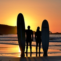 Buy canvas prints of Sunset Surfers by Kelvin Brownsword