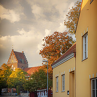 Buy canvas prints of Solvesborg Street Scene With Church by Antony McAulay