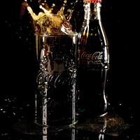 Buy canvas prints of Coca Cola Ice Cube Splash by Antony McAulay