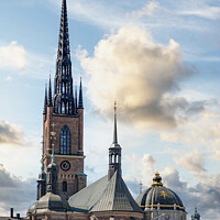 Buy canvas prints of Stockholm Ridderholmen Church with Dramatic Sky by Antony McAulay
