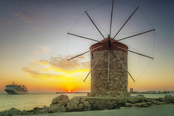Rhodes Windmill and Cruise Ship at Sunrise Picture Board by Antony McAulay