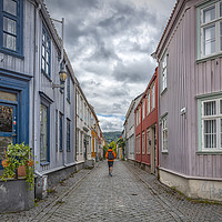Buy canvas prints of Trondheim Narrow Street with Backpacker by Antony McAulay