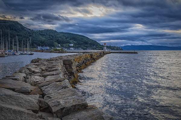 Trondheim Harbour Lighthouse at Sunset Picture Board by Antony McAulay