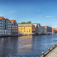 Buy canvas prints of Trondheim River Dockside Warehouses by Antony McAulay