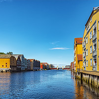 Buy canvas prints of Trondheim Riverside Dockside Warehouses by Antony McAulay