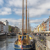 Buy canvas prints of Copenhagen Nyhavn District Fishing Boat by Antony McAulay
