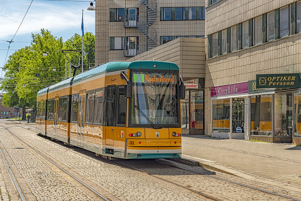 Norrkoping Passing Tram Car Picture Board by Antony McAulay