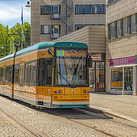 Buy canvas prints of Norrkoping Passing Tram Car by Antony McAulay