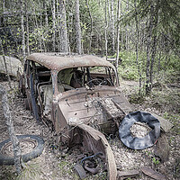 Buy canvas prints of Kirkoe Mosse Bilkyrkogard Rusty Car by Antony McAulay