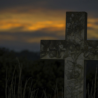 Buy canvas prints of A Grave Sunset.. by Ben Kirby