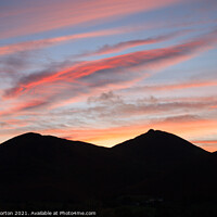 Buy canvas prints of Derwent Fells Silhouetted against the Evening Sky by David Morton