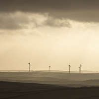 Buy canvas prints of  Fullabrook Windfarm Silhouetted Against the Morni by David Morton