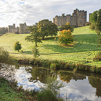 Buy canvas prints of Alnwick Castle above the River Aln by David Morton