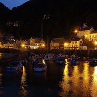 Buy canvas prints of Lynmouth harbour at night by James Thomas