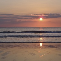 Buy canvas prints of Sunset Woolacombe Beach by James Thomas