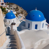 Buy canvas prints of The Churches Of Oia by Mark Robson