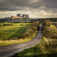 Buy canvas prints of The Road to Bamburgh by Brian Smith