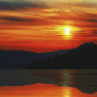 Buy canvas prints of Fiery Sunset over Inveraray by Jane Braat