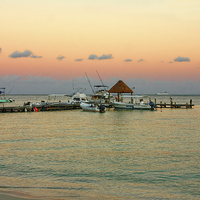 Buy canvas prints of Los Pelicanos Jetty at Dusk by Paul Williams