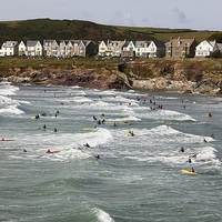 Buy canvas prints of  Polzeath Village with Surfers by Paul Williams