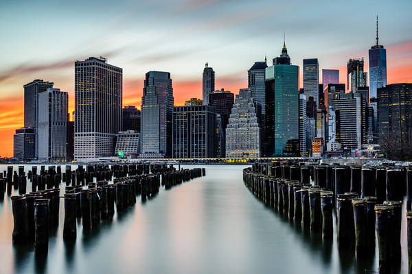 New York Sunset Over The Manhattan Skyline Picture Board by Chris Curry