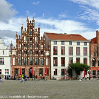 Buy canvas prints of Greifswald - Market Square with Gothic Houses by Gisela Scheffbuch