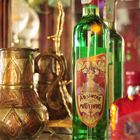 Buy canvas prints of Bottle with green absinthe by Matthias Hauser