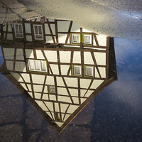 Buy canvas prints of Half-timbered house water reflection by Matthias Hauser