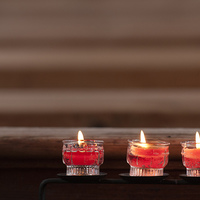Buy canvas prints of Three prayer candles in church by Matthias Hauser