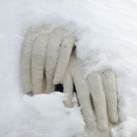 Buy canvas prints of Snow covered hands of a statue by Matthias Hauser