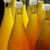 Buy canvas prints of Apple juice in bottles by Matthias Hauser