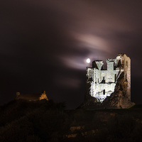Buy canvas prints of Moon Behind The Castle by Andrew McCauley