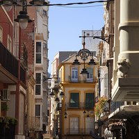 Buy canvas prints of Spanish Street at Noon by Jonathan Parkes