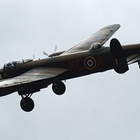 Buy canvas prints of  Lancaster Flying High by Peter Farrington