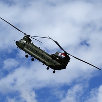 Buy canvas prints of  Chinook High In The Clouds by Peter Farrington