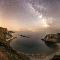 Buy canvas prints of  The Milky way over Man O War cove  by Shaun Jacobs