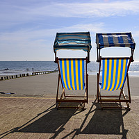 Buy canvas prints of Deck chairs on the beach  by Shaun Jacobs