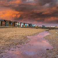 Buy canvas prints of Beach hut sunset in Poole.  by Shaun Jacobs